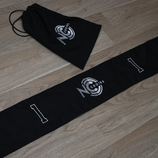 Black drawstring bag and black fabric number line with Logo and numbers embroidered on it.