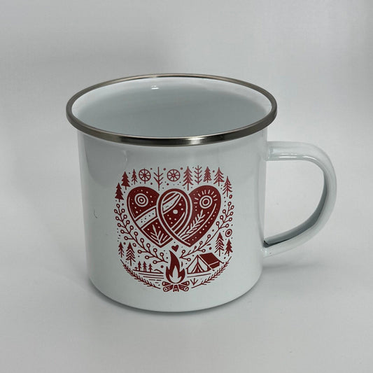 White enamel mug with red heart and nature-themed design on a gray background