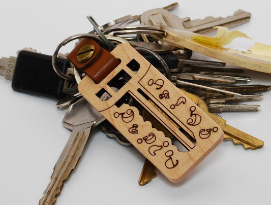 Wooden keychain with intricate designs with attached keys