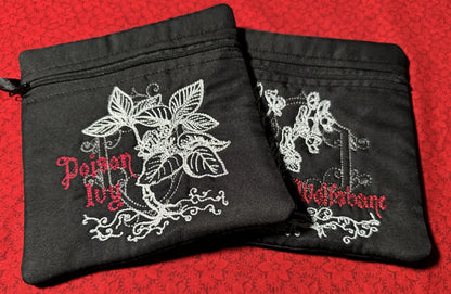 Two Bramble & Bone zippered pouches, Poison Ivy and Wolfsbane, silver botanical embroidery on black