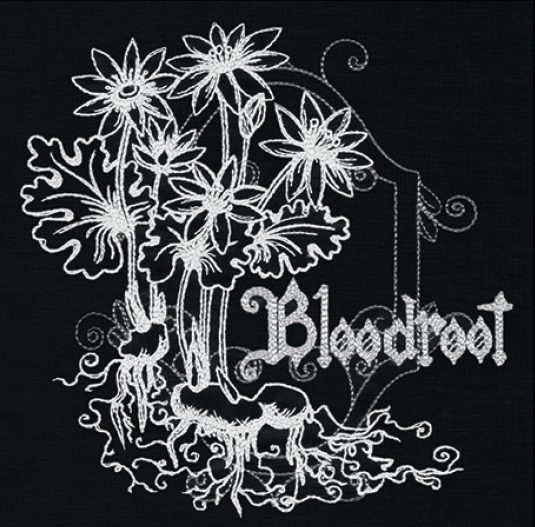 Bloodroot embroidery design, shown as it stitches: light thread on black